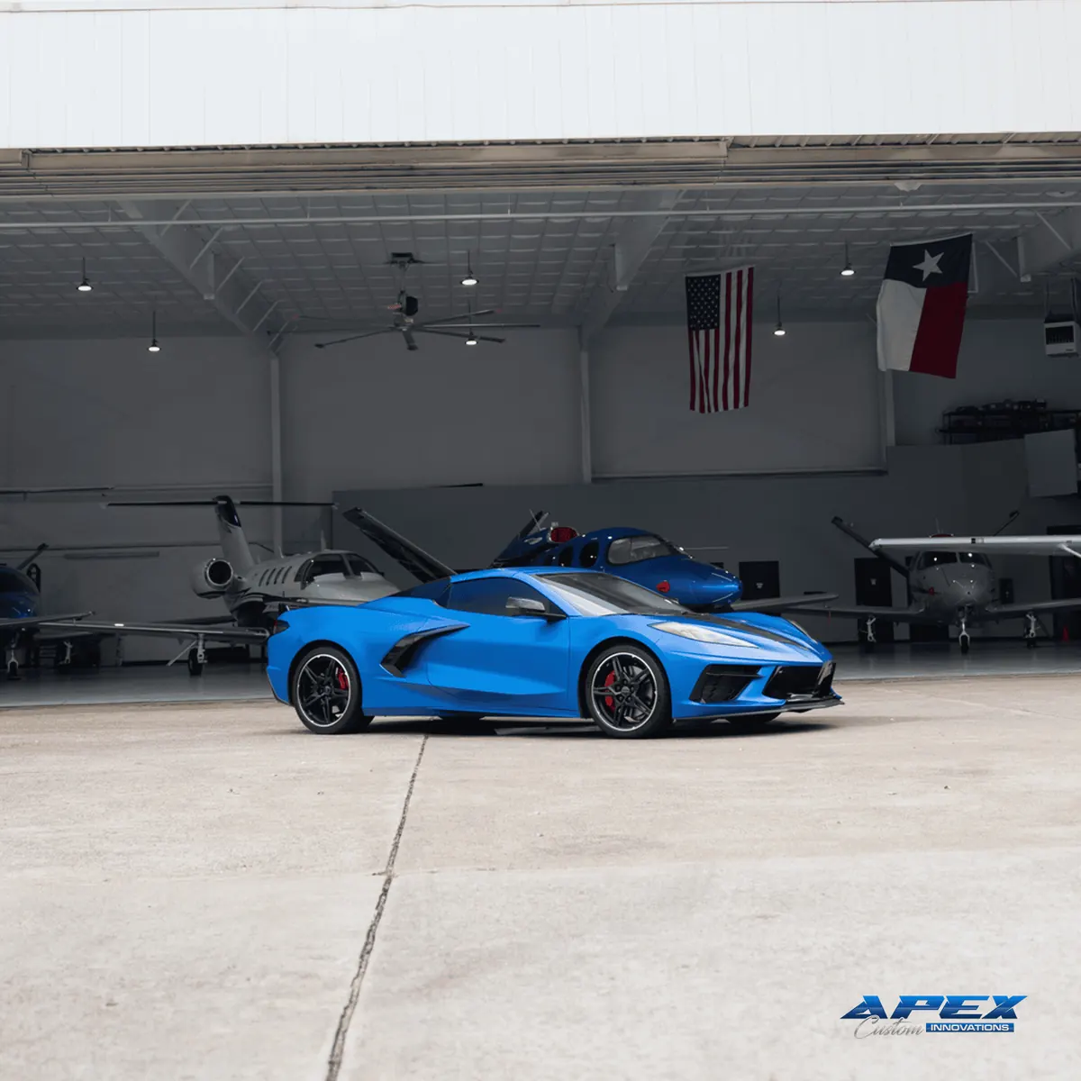 Blue 2024 Chevrolet Corvette Stingray with XPEL PPF in an aircraft hangar